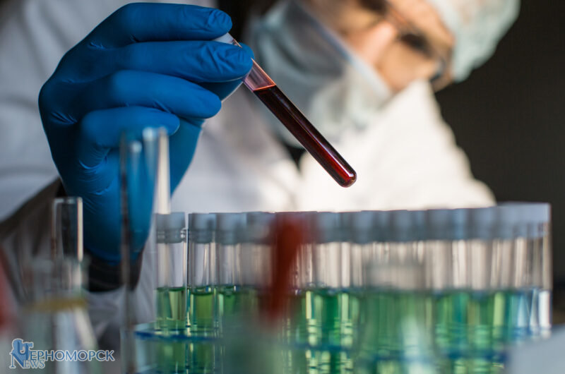 researcher-looking-on-blood-sample-in-test-tube